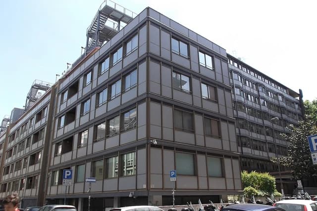 Exterior of the Enel headquarters building in Rome, Italy, under a clear sky.