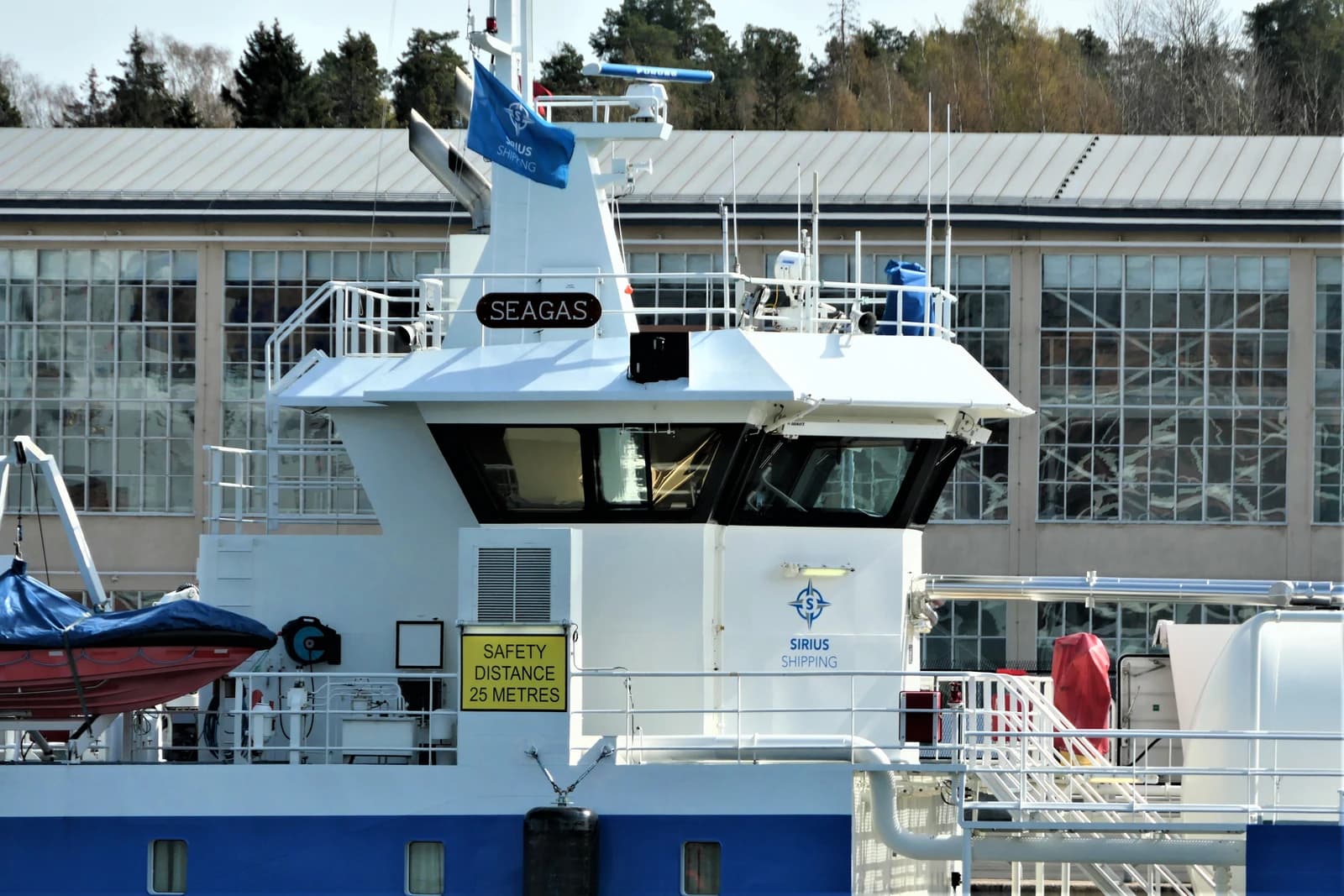 The bridge of the MS Seagas, an LNG bunker vessel, featuring its name and flag.