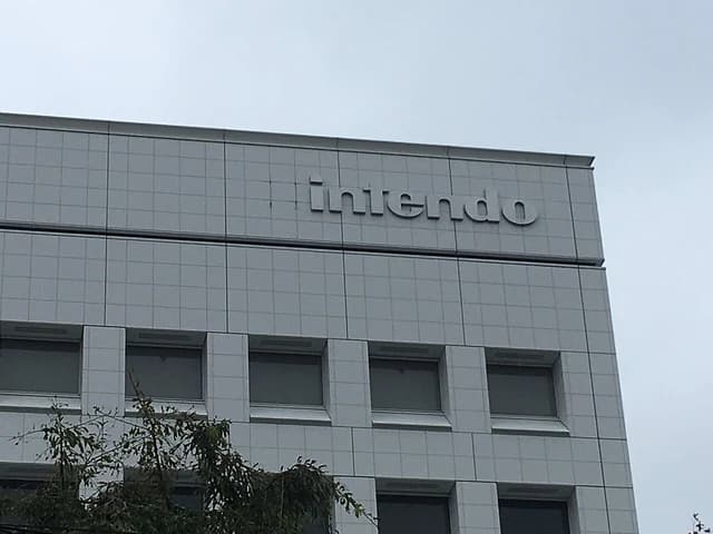 The Nintendo corporate building in Kyoto, Japan, with the company name on its facade.