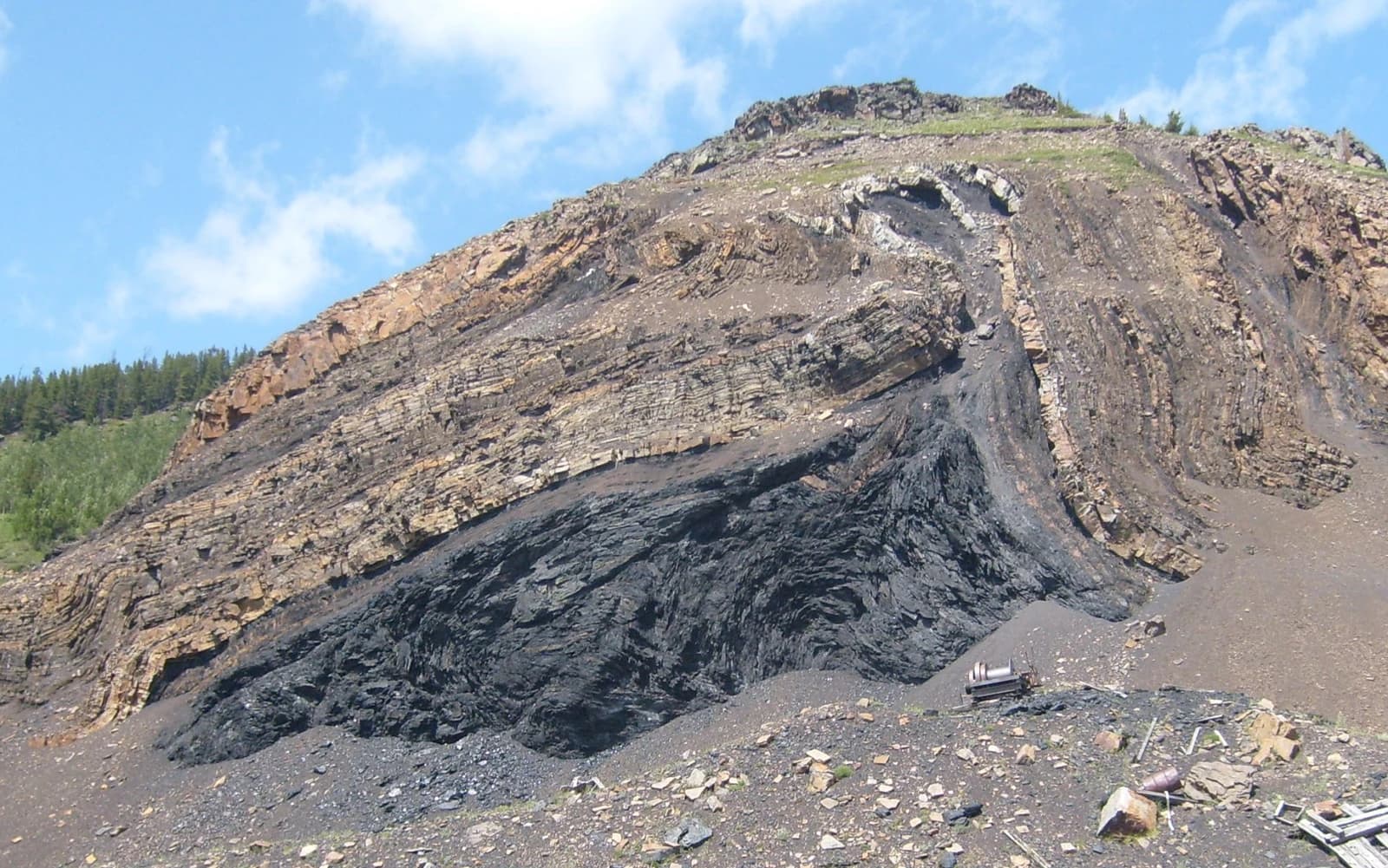 Exposed coal seam and surrounding rock on Grassy Mountain in Alberta.