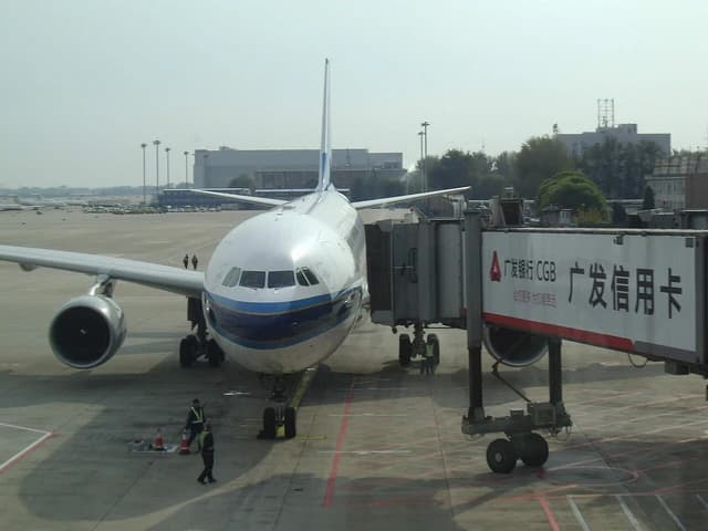 An airplane is connected to a jet bridge at Beijing International Airport.