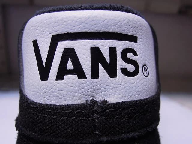 Close-up of the Vans brand logo on a shoe.