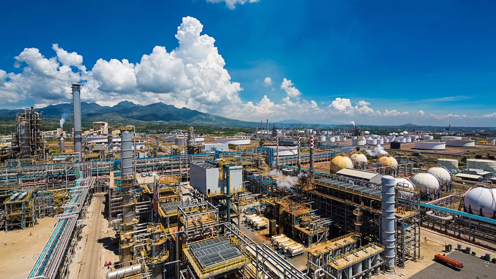 Aerial view of the extensive Petron Bataan Refinery with storage tanks and industrial structures.