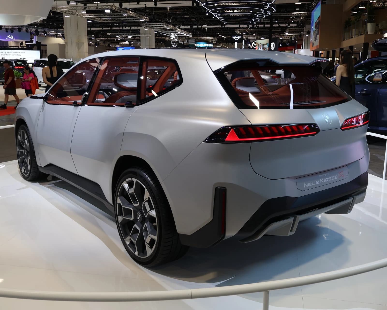 BMW Vision Neue Klasse X showcar displayed from the rear angle at an auto show.