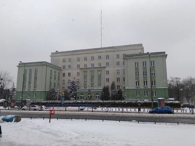 Border Guard headquarters building in Warsaw under a light snowfall.