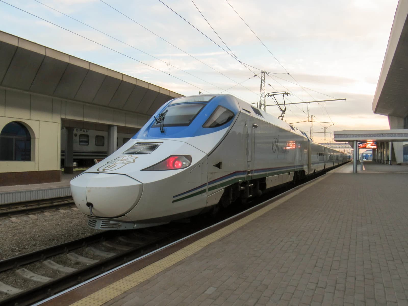An Afrosiyob high-speed train stopped at a platform in Tashkent, Uzbekistan.