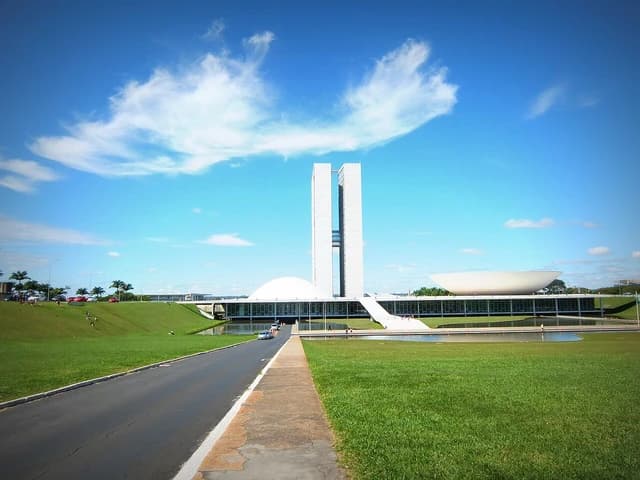 National Congress of Brazil building with two tall towers and domed structures.