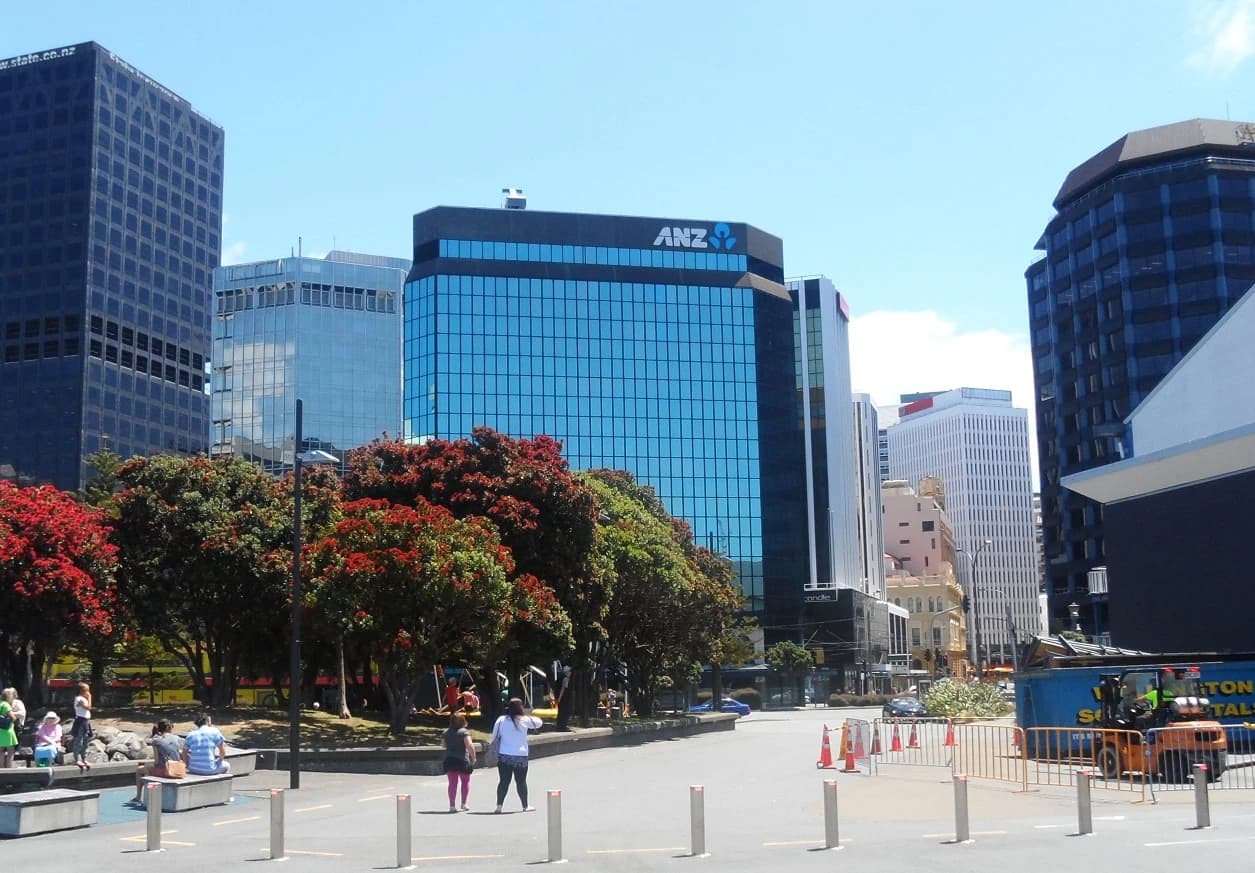 ANZ building at 1 Victoria Street in Wellington, New Zealand, with pedestrians and trees.