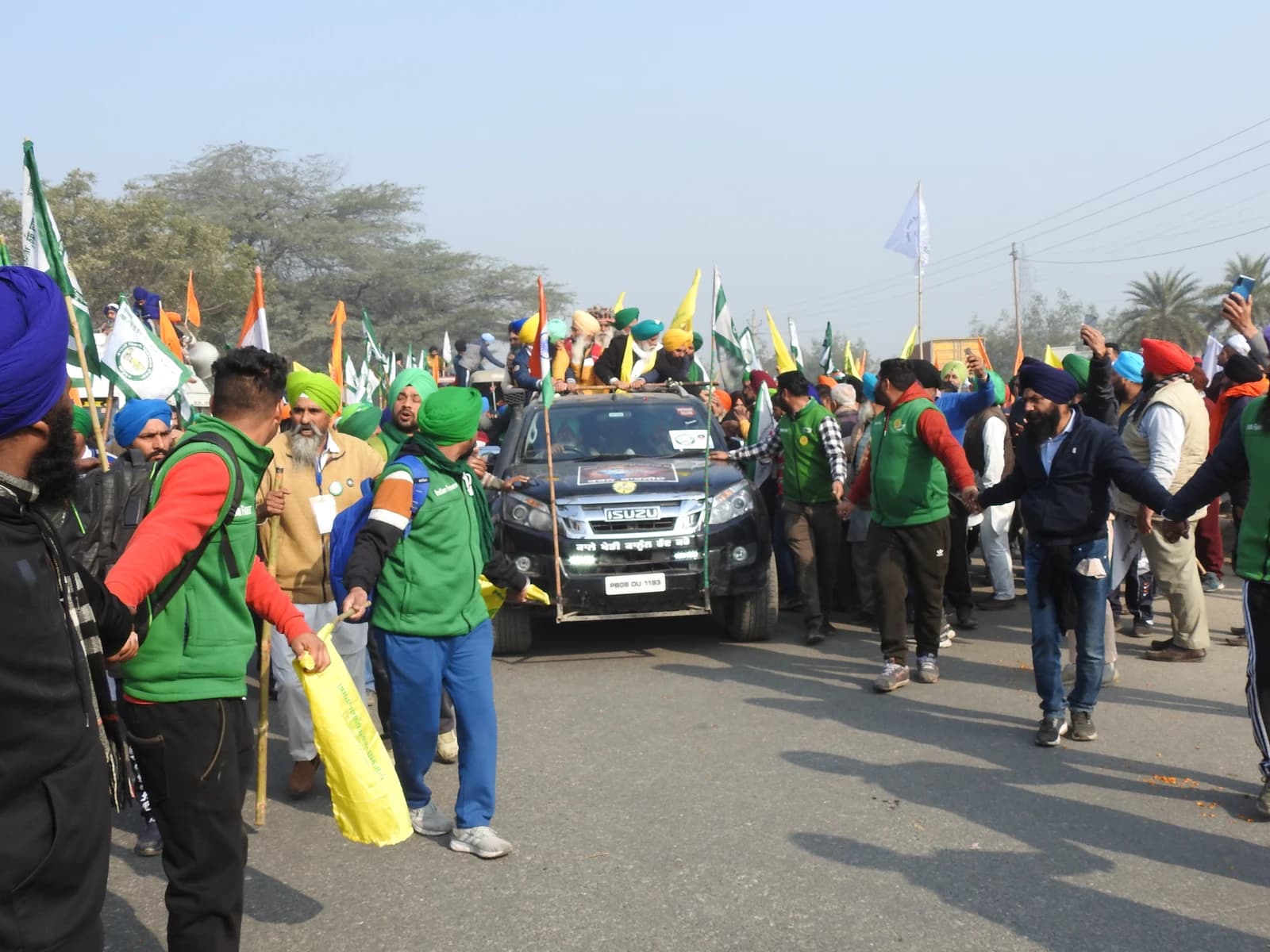 Balbir Singh Rajewal, President of Bhartiya Kisan Union (BKU Rajewal), surrounded by supporters during a protest.