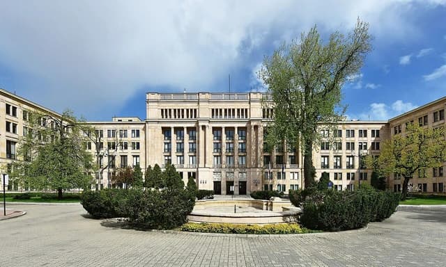 The Ministry of Finance building in Warsaw, Poland, with a fountain in front.