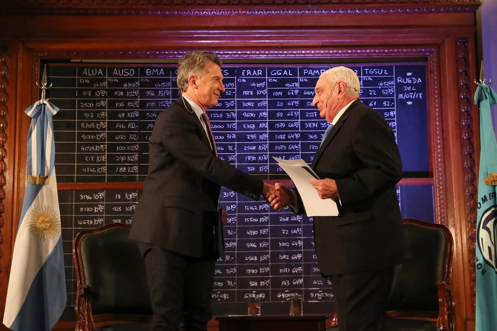 Mauricio Macri, former President of Argentina, shaking hands with a man at an event.