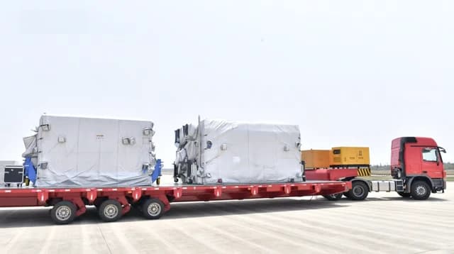 Chang'e 7 probe, covered in protective tarps, on a transport truck at Wenchang Space Launch Center.