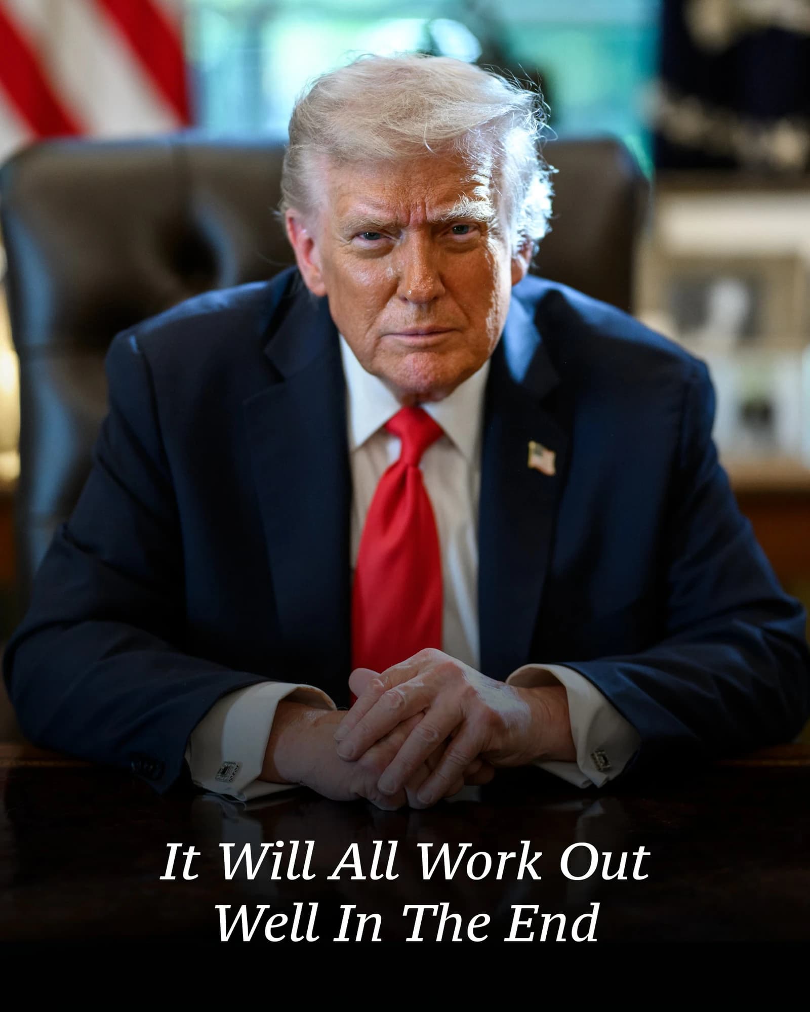 Donald Trump, former President, seated at a desk in an office.
