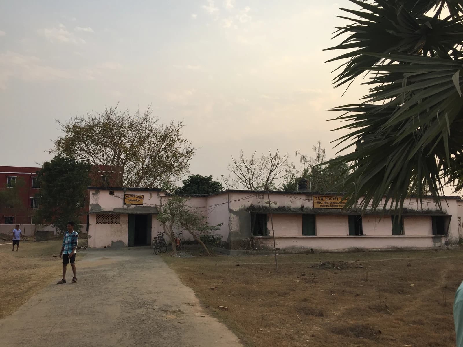 The exterior of T.R.W. Hostel building at M.P.C. Autonomous College in Odisha.