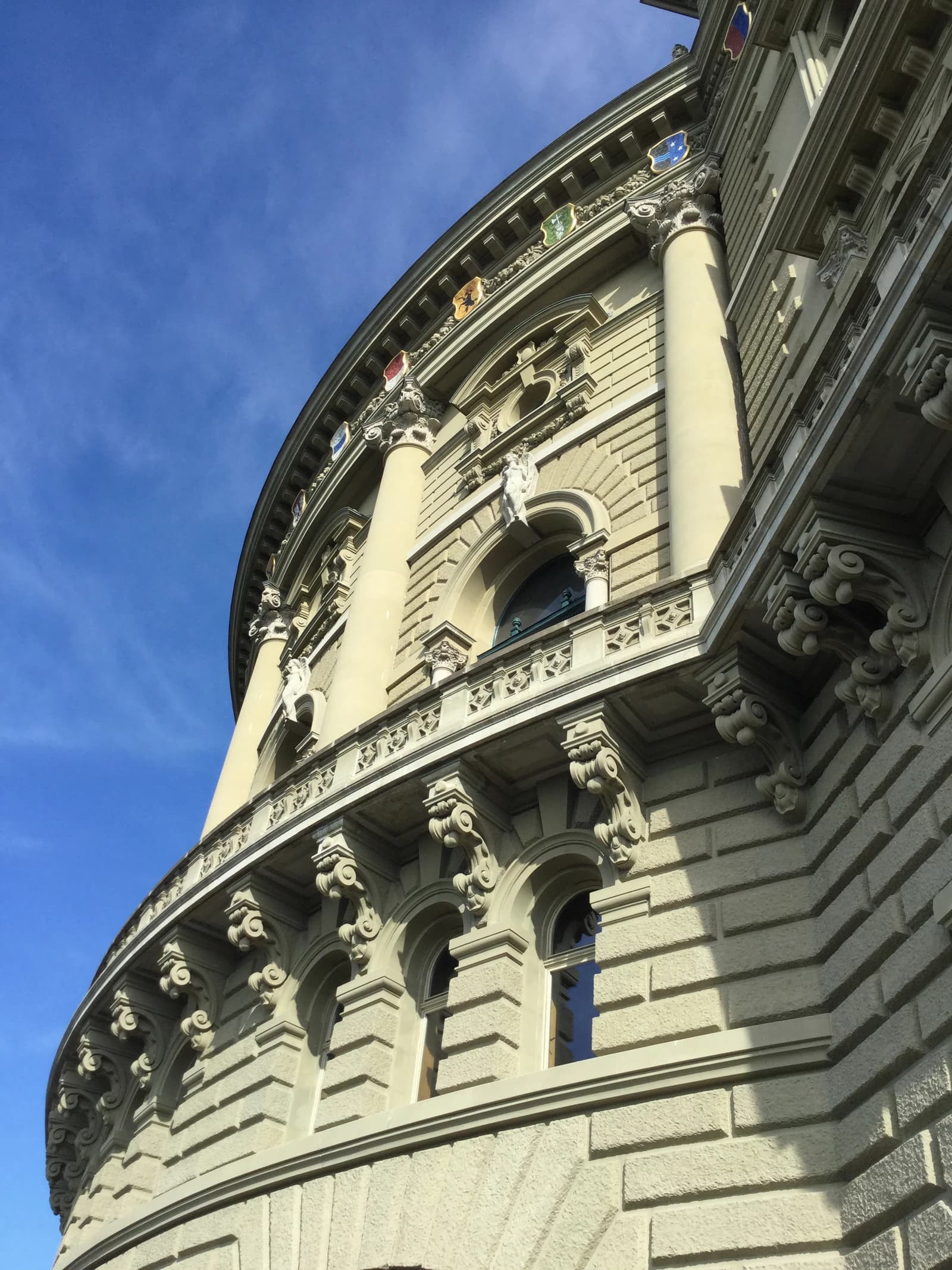 Exterior facade of the Bundeshaus in Bern, Switzerland, showing architectural details.