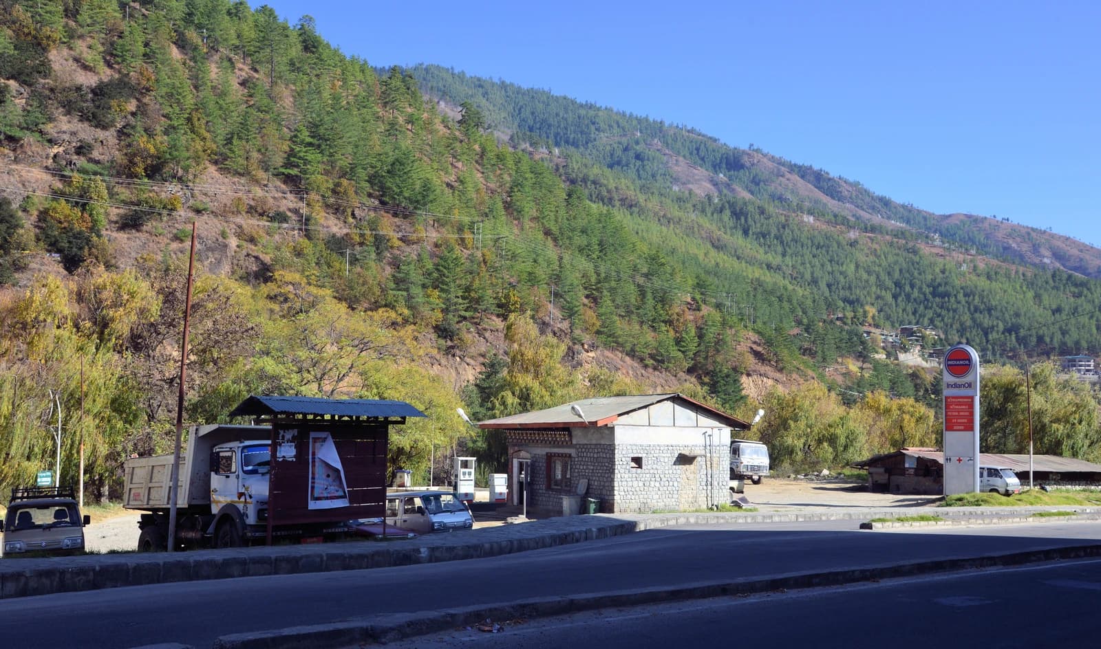 Petrol station with fuel pumps and signage in Chubachu, Thimphu.