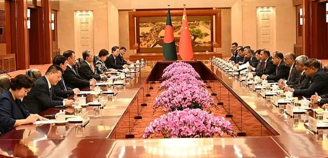 Tarique Rahman and Zhao Leji attend a meeting with delegations at the Great Hall of the People.