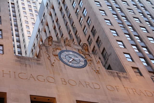Exterior of the Chicago Board of Trade building with a large clock and sculptures.