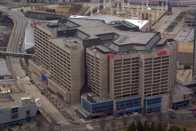 Aerial view of CNN Center in Atlanta, Georgia, with surrounding roads and buildings.