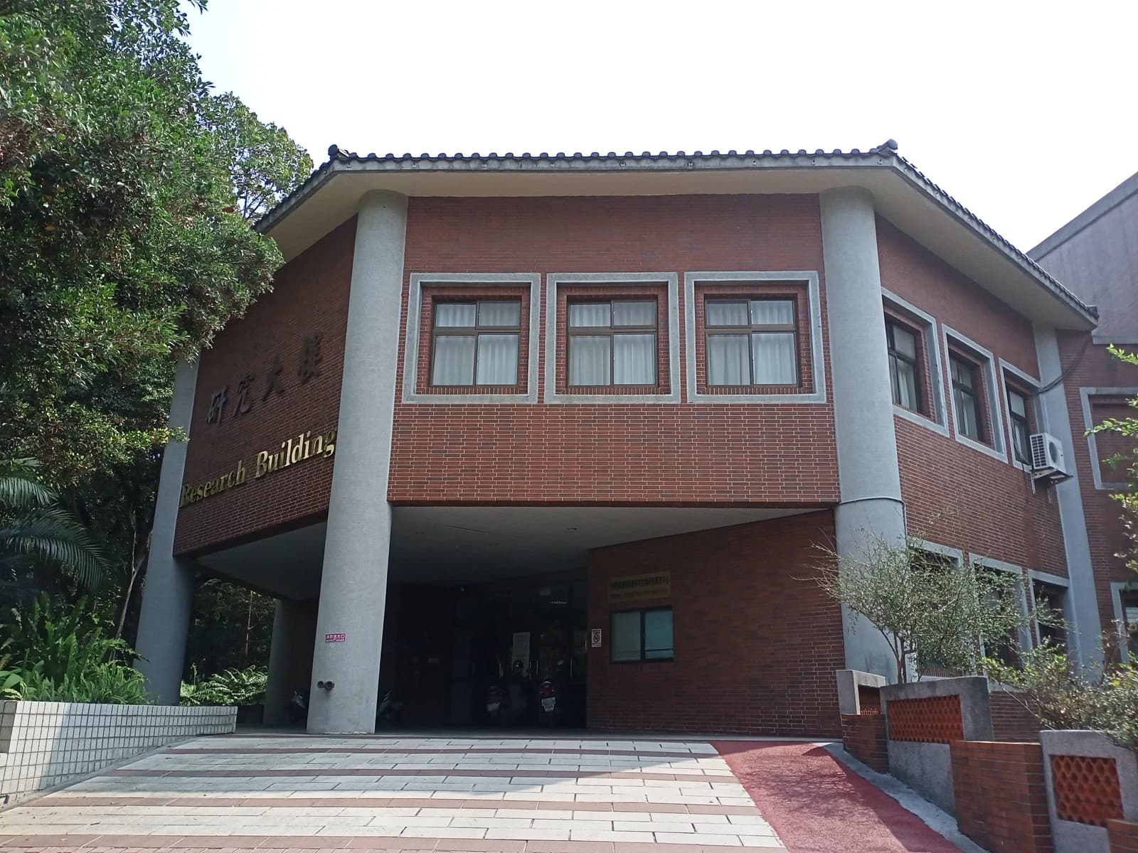 Exterior of the ESRI Research Building with brick facade and large columns.