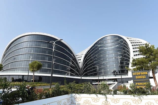 Headquarters of Star Oil Refinery with modern architecture and landscaping.