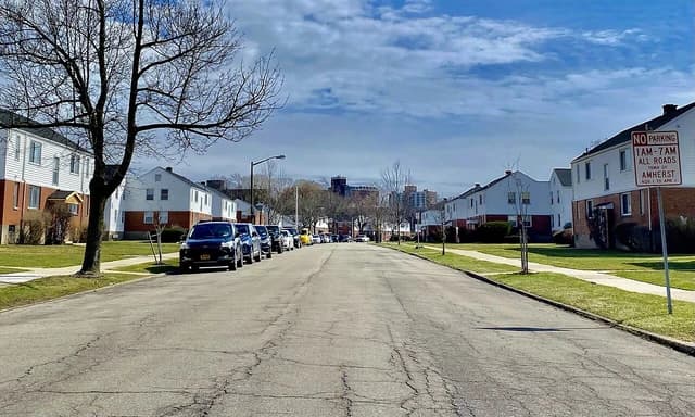 Princeton Court Apartments in Amherst, New York, with the UB South skyline in the background.
