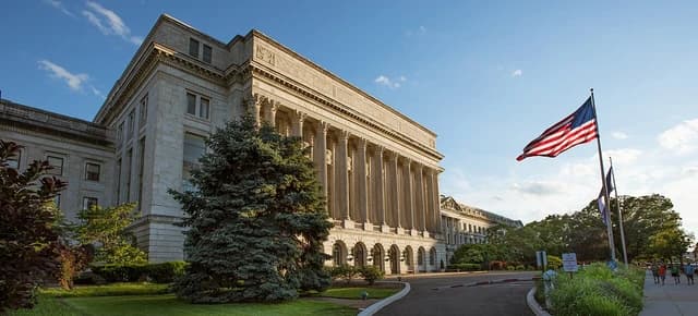 Jamie L. Whitten Federal Building, a large classical government building with columns and an American flag.