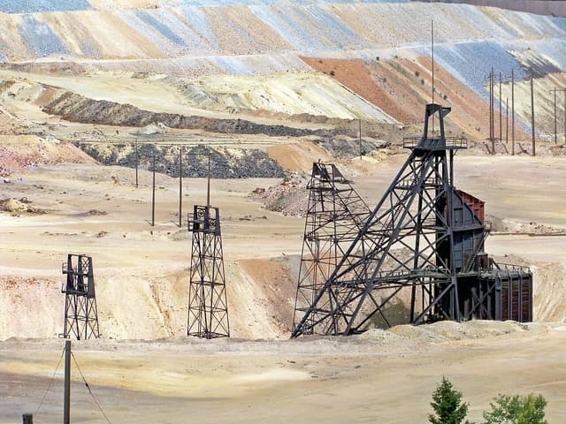 View of the Granite Mountain Mine headframe and open-pit mining landscape.