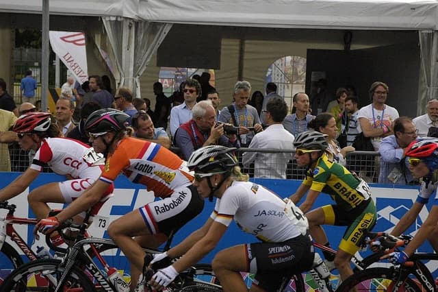 Female cyclists Ellen van Dijk, Trixi Worrack, Eugenia Bujak, and Flavia Oliveira in a race.