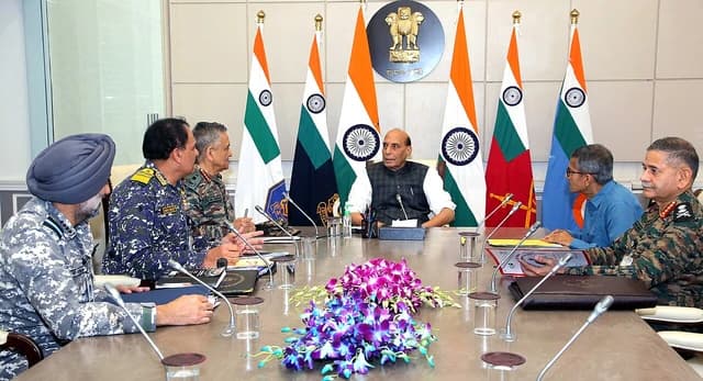 Rajnath Singh, Minister of Defence, seated at a table with military chiefs and Defence Secretary.