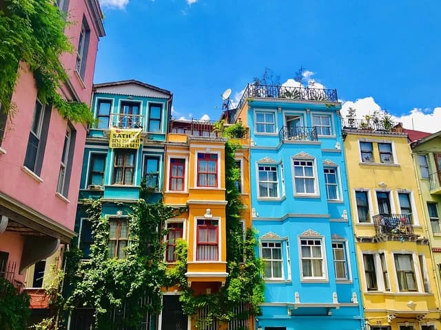 Colorful historic apartment buildings line a street in Istanbul, Turkey.