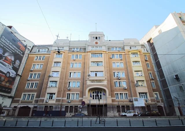 Exterior facade of the Politia Bucuresti building with street in foreground.