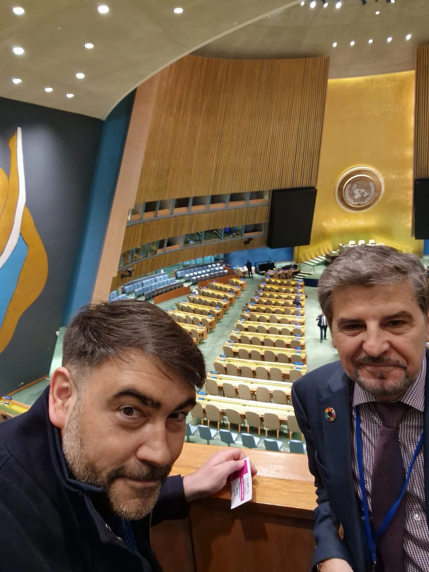 Alejandro Sturniolo and Domingo Zarzo stand in the United Nations General Assembly Hall.
