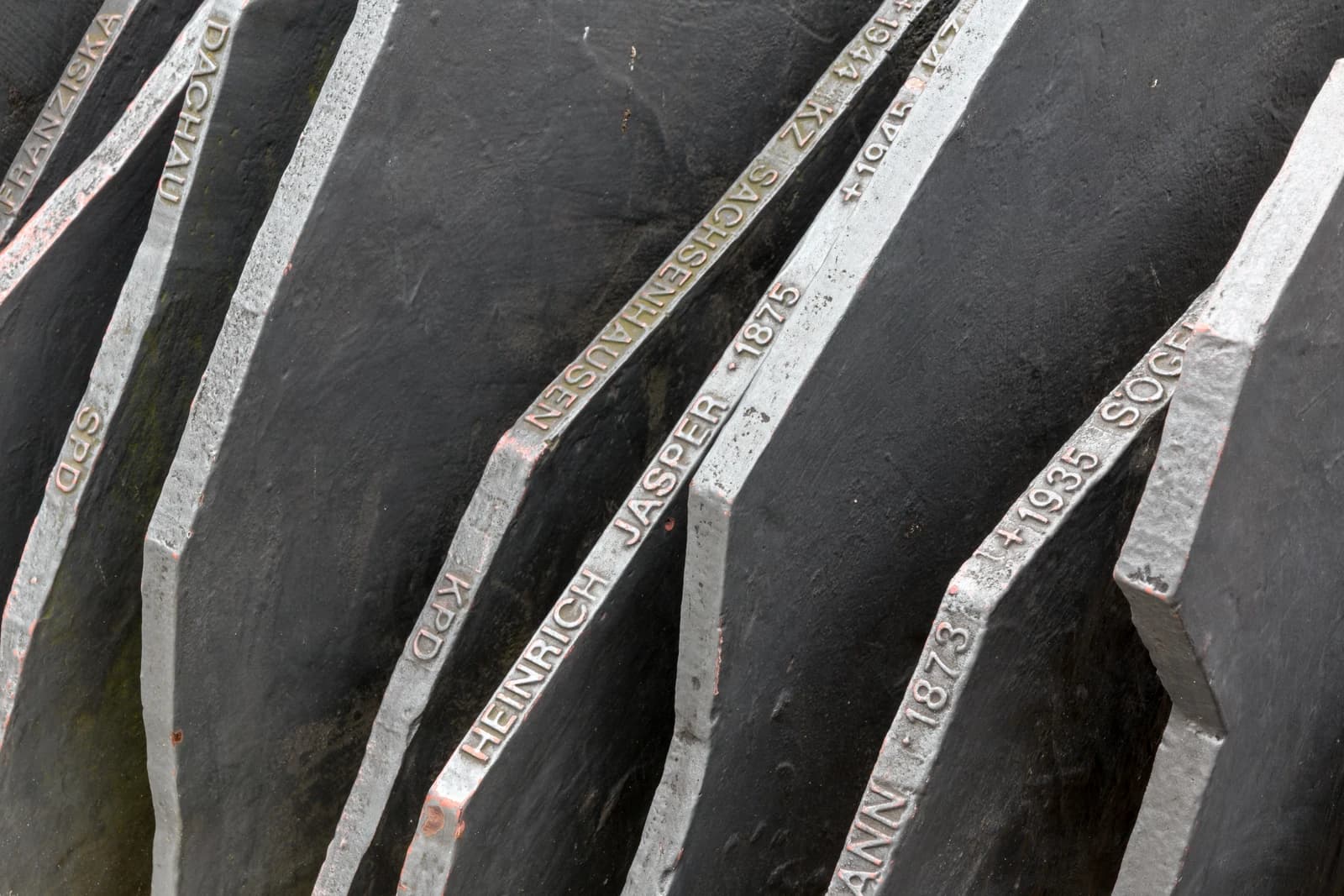 Close-up of the Berlin memorial for Reichstag members murdered by National Socialists, showing engraved names.