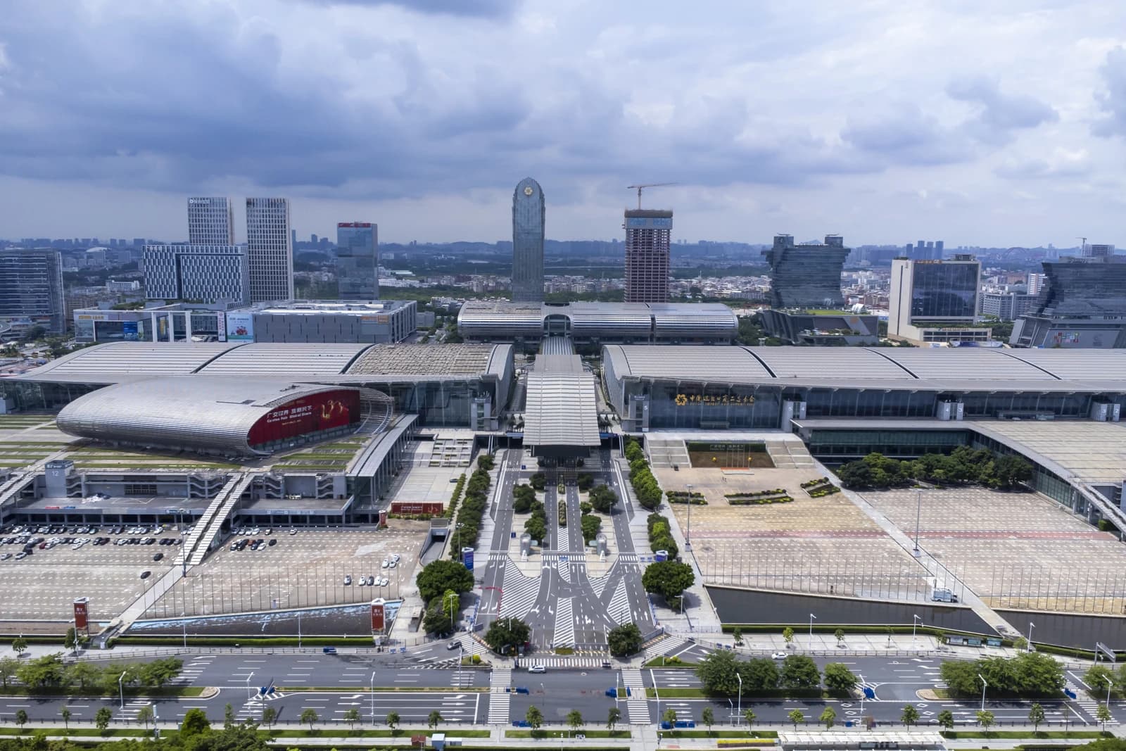 Aerial view of the large, modern Canton Fair Complex with surrounding city buildings.