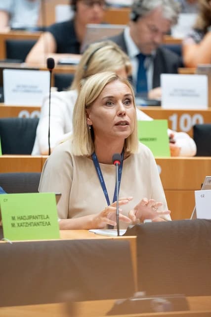 M. Hadjipantela speaking at a microphone during a European Parliament event.