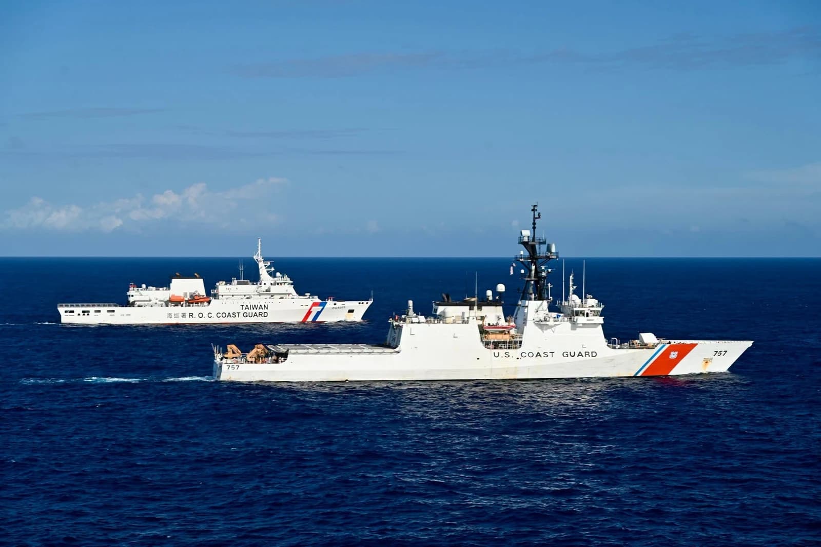 U.S. Coast Guard Cutter Midgett and Taiwan Coast Guard patrol vessel Taipei sailing on ocean.