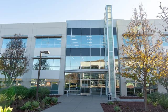 Applied Intuition headquarters building, a modern office structure with glass and white panels.