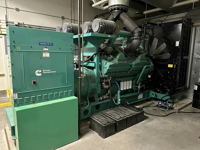 Industrial generator unit labeled 'GENERATOR B' and 'Power Generation' in a data center.