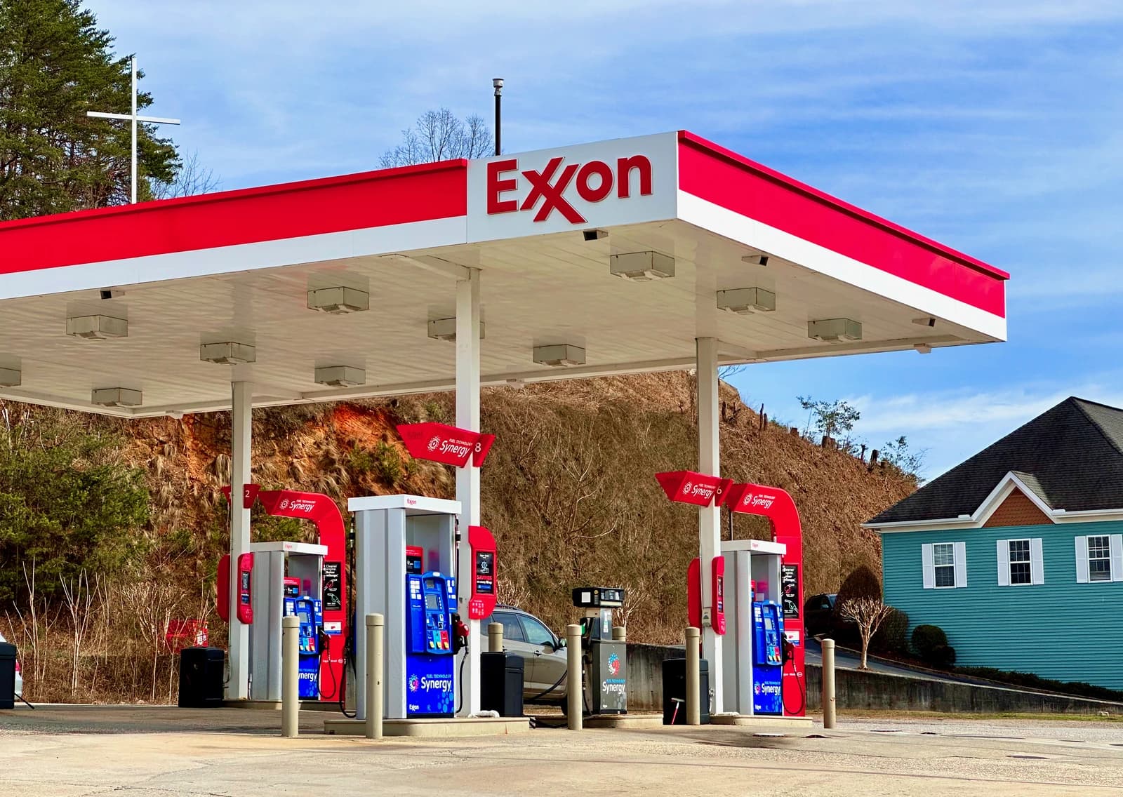 An ExxonMobil gas station with multiple pumps under a red and white canopy in Hiawassee, Georgia.
