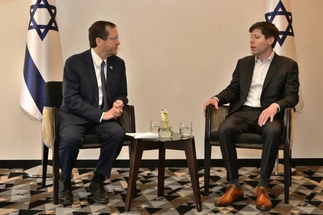 Isaac Herzog, President of Israel, and Sam Altman, CEO of OpenAI, sit facing each other.