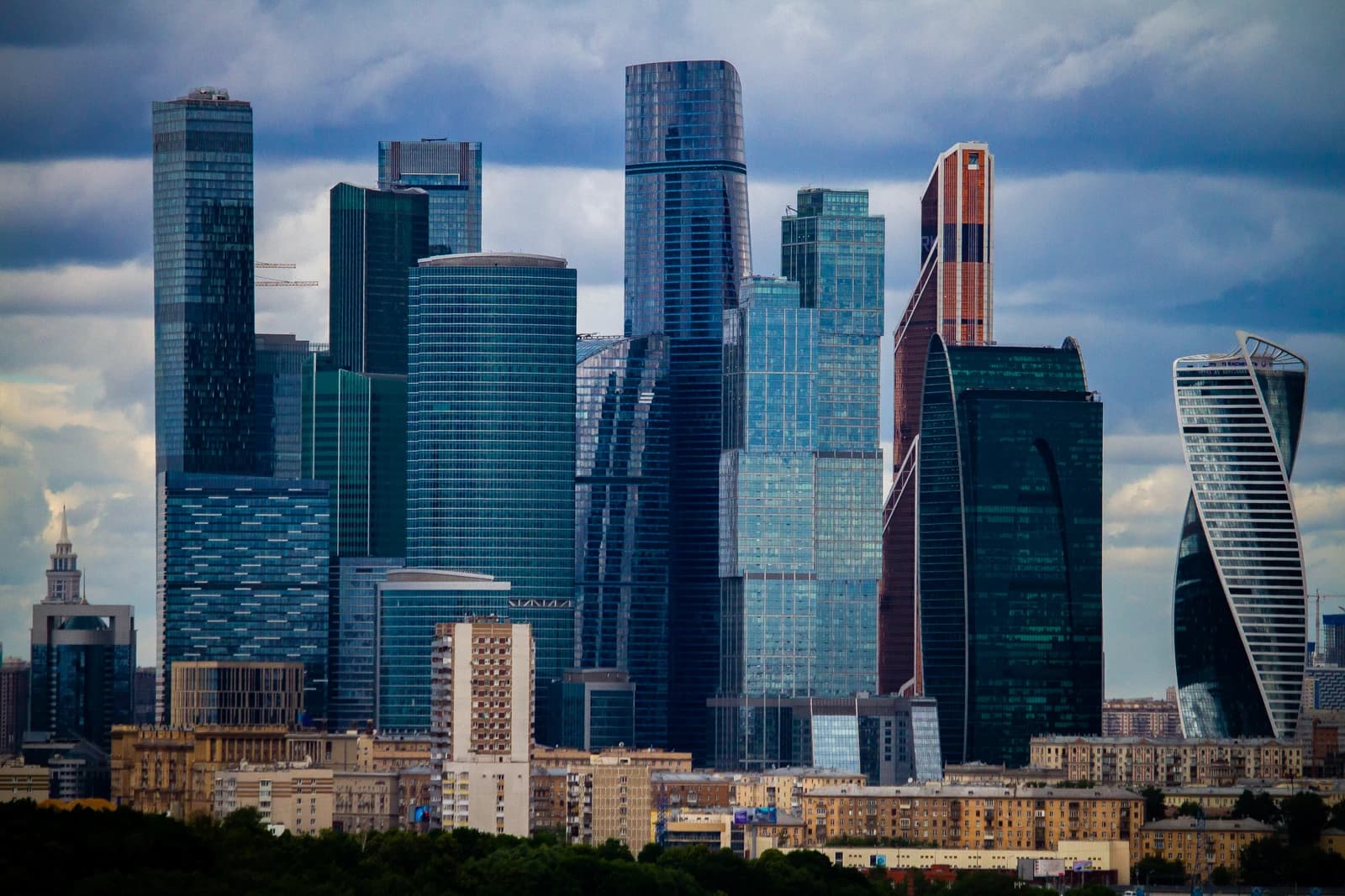 Skyscrapers of the Moscow International Business Center rise above residential buildings.