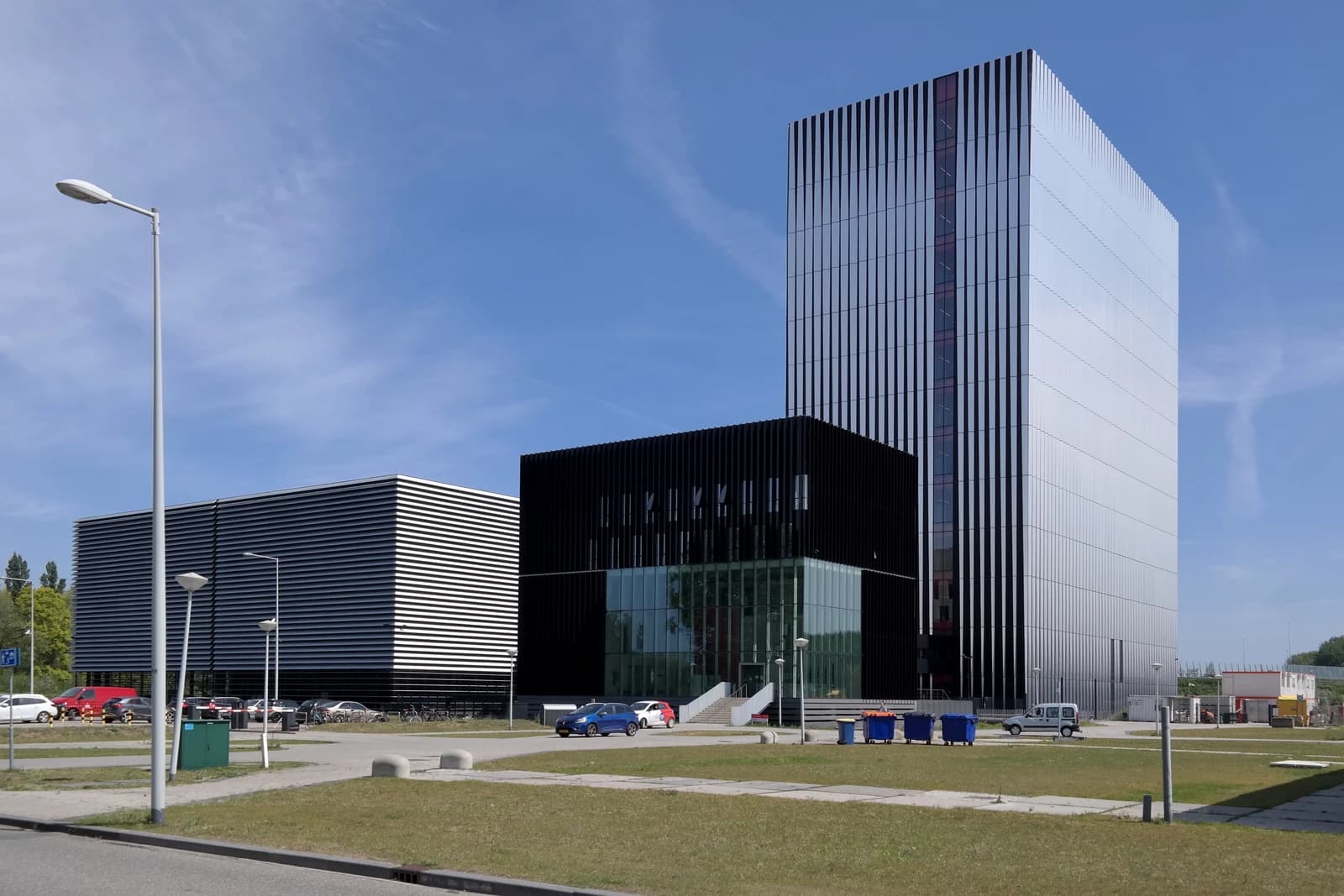 Equinix AM3 and AM4 data centers in Amsterdam, showing modern building exteriors.