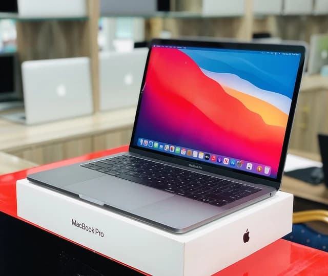 A 2019 model MacBook Pro laptop resting on its white product box.