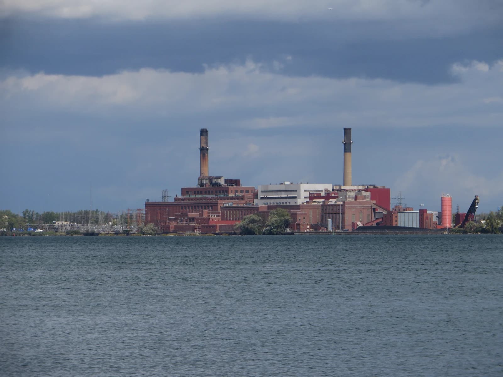 Huntley Station coal-fired power plant in Tonawanda, New York viewed from across a body of water.