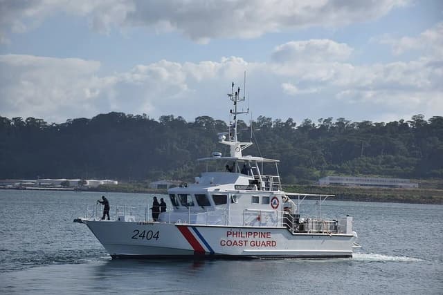 The Philippine Coast Guard vessel BRP Kalanggaman (FPB 2404) sailing on blue water.