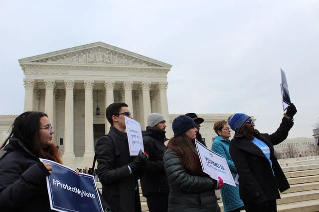 Protesters holding signs outside the US Supreme Court building in Washington, D.C.