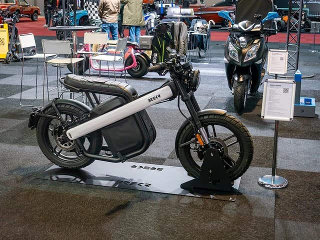 Brekr B4000 electric motorcycle on display at a Brussels auto show.
