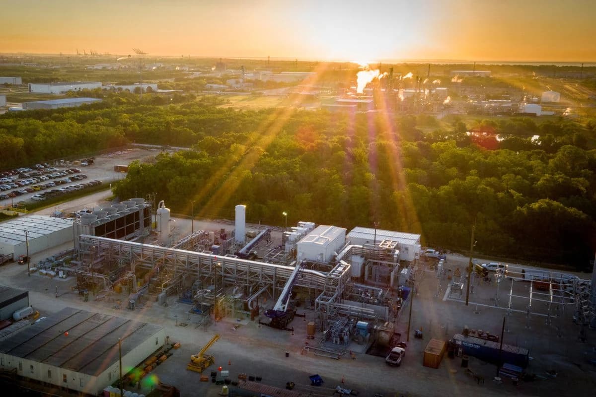 Aerial view of NET Power natural gas-fired power plant with sun setting in background.