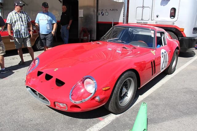 Red 1963 Ferrari 250 GTO Berlinetta on display at an outdoor event.